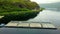 Aerial view of a half-constructed pier in the water of a lake in a rural area in daylight