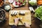 Aerial view of hand with knife cutting mushroom