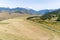 Aerial view of harvested Hay field with mountains in background, Carretera Austral route - Coyhaique, AysÃ©n, Chile