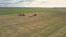 Aerial view harvesters truck and minivan stand on field