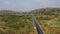 Aerial view of heavy truck running on asphalt highway