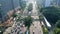 Aerial view of hectic traffic on the road with office buildings in the Jakarta city, Indonesia