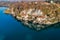 Aerial view of Hermitage of Santa Caterina del Sasso, clinging to a rock face directly overhanging the lake Maggiore.