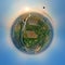 Aerial view from high altitude of little planet earth with small hot air baloon flying on orbit over rural countryside