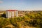 Aerial view of high residential apartment building in green rural area in Ivano-Frankivsk city, Ukraine