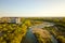 Aerial view of high residential apartment building in green rural area in Ivano-Frankivsk city, Ukraine