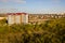 Aerial view of high residential apartment building in green rural area in Ivano-Frankivsk city, Ukraine