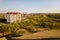 Aerial view of high residential apartment building in green rural area in Ivano-Frankivsk city, Ukraine