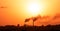 Aerial view of high smoke stack with smoke emission. Plant pipes pollute atmosphere. silhouette background