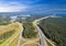 Aerial view of highway in city. Cars crossing interchange overpass. Highway interchange with traffic. Aerial bird`s eye photo of