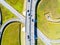 Aerial view of highway in city. Cars crossing interchange overpass. Highway interchange with traffic. Aerial bird`s eye photo of