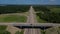 Aerial view of highway cloverleaf interchange seen from above.