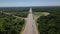 Aerial view of highway cloverleaf interchange seen from above.