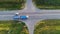 Aerial view of highway in countryside. Cars crossing cross road.