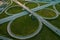 Aerial view at highway intersection or road junction with circle movement at sunset, cars and trucks traffic