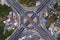 Aerial view of highway junctions with roundabout. Bridge roads shape circle in structure of architecture and transportation