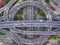 Aerial view of highway junctions with roundabout. Bridge roads shape circle in structure of architecture and transportation