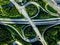 Aerial view of highway and overpass with green woods in Finland