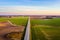 Aerial view of a highway passing through spring agricultural fields