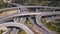 Aerial view of highway road, interchange and overpass in city.