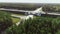 Aerial view of the highway, road junction. Trucks and cars are driving on an asphalt road. Intercity cargo