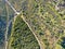 Aerial view of hiking sandy trails in dry green mountain