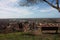 Aerial view from a hill. a quiet, green, quiet and peaceful public park. a solitary bench, a tree and a view of the town