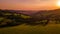 Aerial view of the hill on which lies a lone tree overlooking the surrounding hilly landscape of the Beskydy Mountains