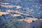 Aerial view of hills covered by vineyards and mansions in Santa Cruz Mountains, Saratoga, California