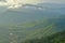 Aerial view of hills in rural covered with fog in the morning