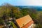 Aerial view from hilltop around with countryside green rice fields and blue sky background at Wat Khao Rup Chang or Temple of the