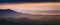 Aerial View of Hilly British Countryside at Sunset