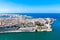 Aerial view of historical Valetta, capital city of Malta, Grand harbour, Sliema town, Marsamxett bay from above.