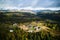 Aerial view of holiday cottages in mountains.