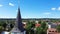 Aerial View of the Holy Trinity Lutheran Church in Tukums, Latvia. Golden Cock Statue on the Top of Tower.