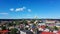 Aerial View of the Holy Trinity Lutheran Church in Tukums, Latvia. Golden Cock Statue on the Top of Tower.