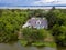 Aerial view of home on wooded property