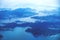 Aerial view of Hong Kong islands in blue morning mood from a flying airplane