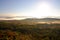 An aerial view of a hot air balloon floating over the Vermont country side