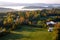 An aerial view of a hot air balloon floating over the Vermont country side