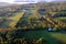 An aerial view of a hot air balloon floating over the Vermont country side