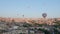 Aerial view from hot air balloon during Sunrise over the fairytale landscape hills of Kapadokya with morning light.