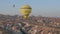 Aerial view from hot air balloon during Sunrise over the fairytale landscape hills of Kapadokya with morning light.