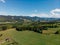 aerial view of houses forest and mountains in arezzo