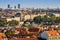 Aerial view of houses, roofs and Charles Bridge of Prague.