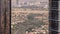 Aerial view of housing development promenade with JLT district skyscrapers and artificial lake with a park timelapse.