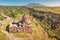 Aerial view of Hovhannavank monastery and church on the edge of a scenic Kasakh gorge and canyon. Travel and religious