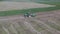 Aerial view how tractor making bales