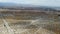 Aerial view of huge array of gigantic wind turbines spreading over the desert in Palm Springs.