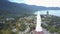 Aerial view huge buddha statue on hilltop against pagoda